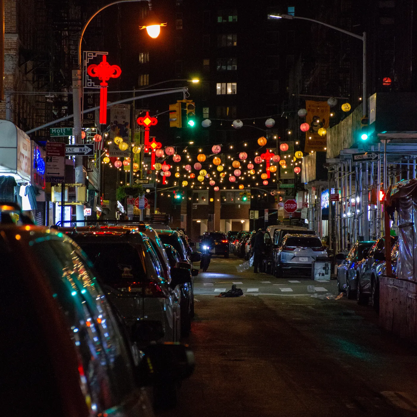 Lanterns strung over Mott Street, Chinatown, well after midnight.