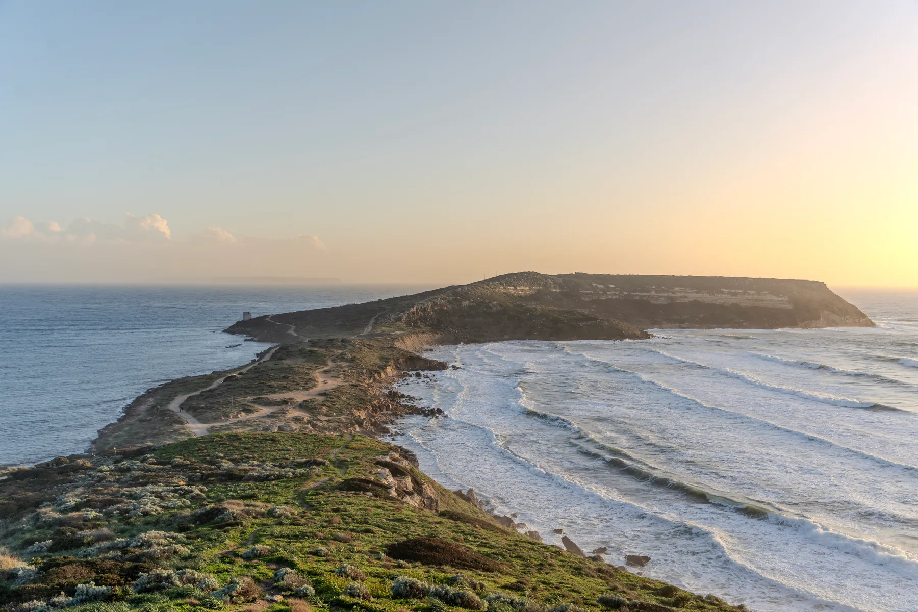The Sinis peninsula narrowing towards Capo San Marco at sunset.