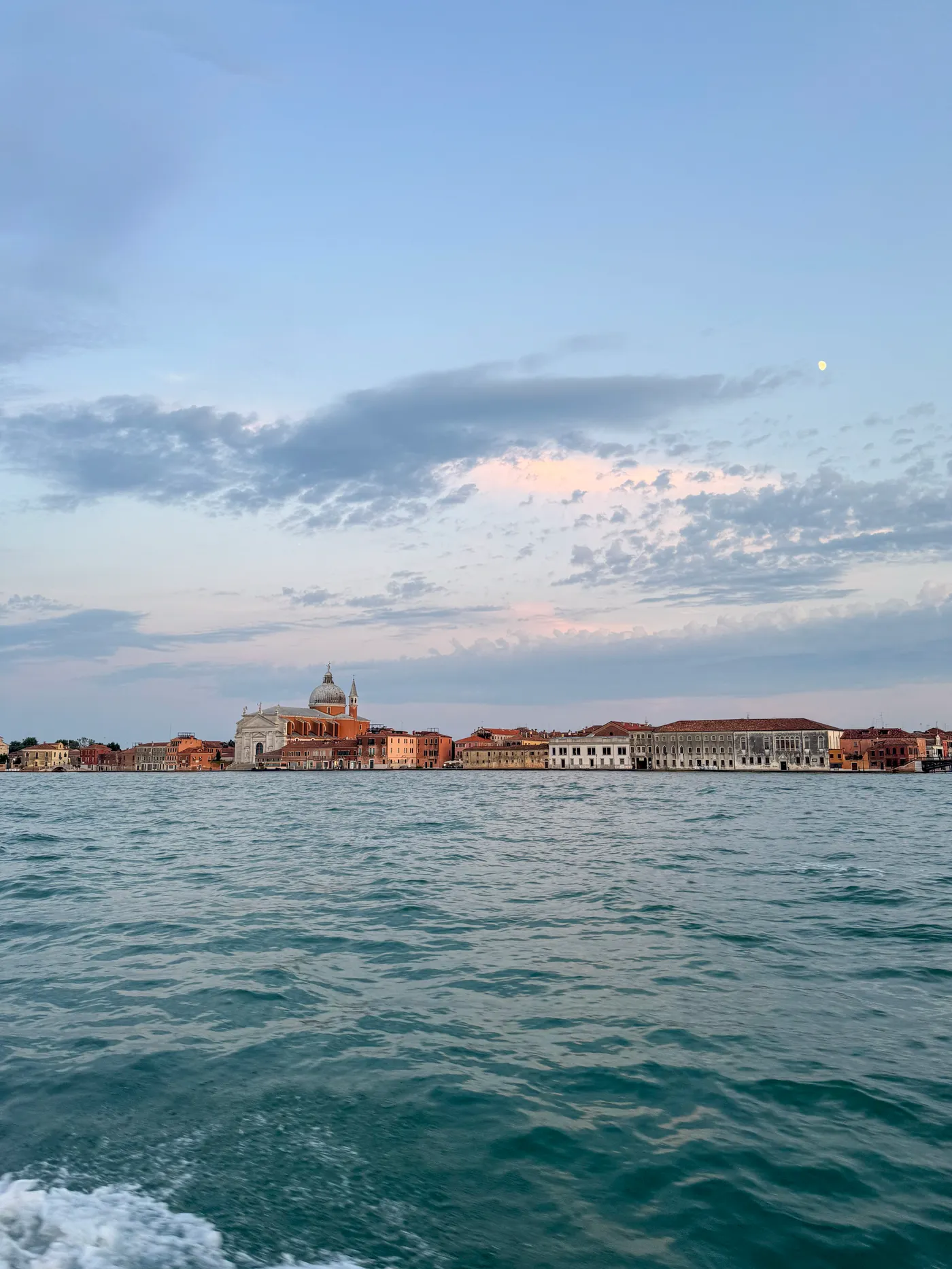 The Giudecca and the dome of the Redentore from the water, the moon already up.