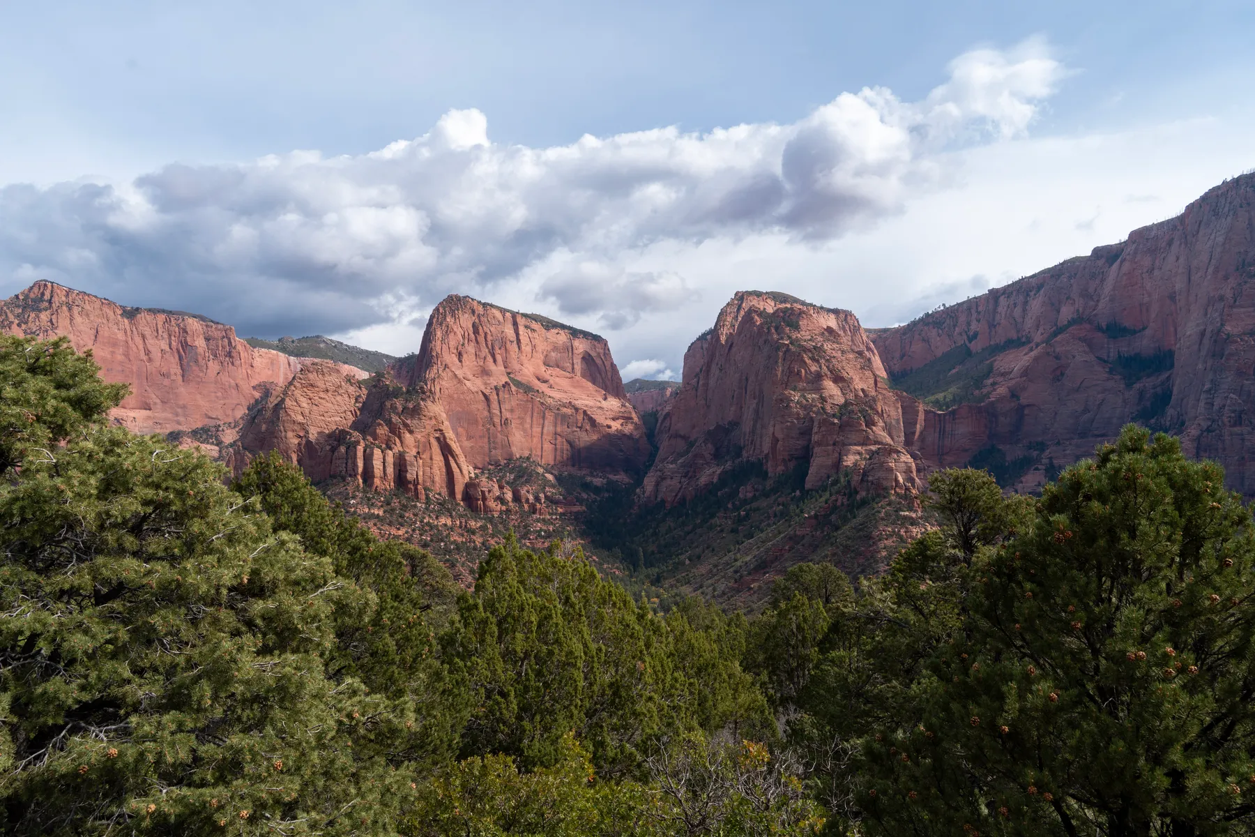 Kolob Canyons, the light breaking through onto the cliffs after a storm.