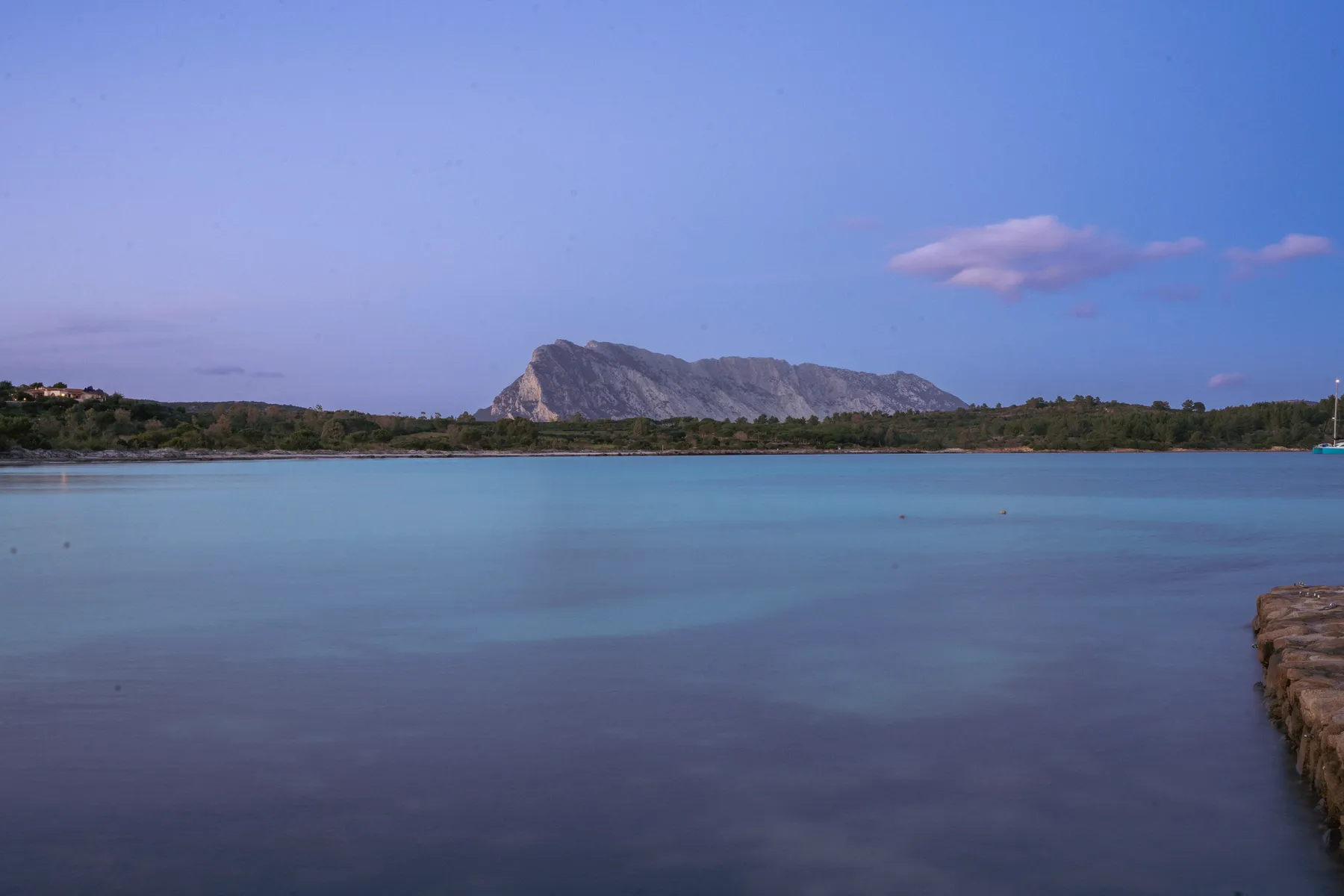 Tavolara at dusk across the lagoon.
