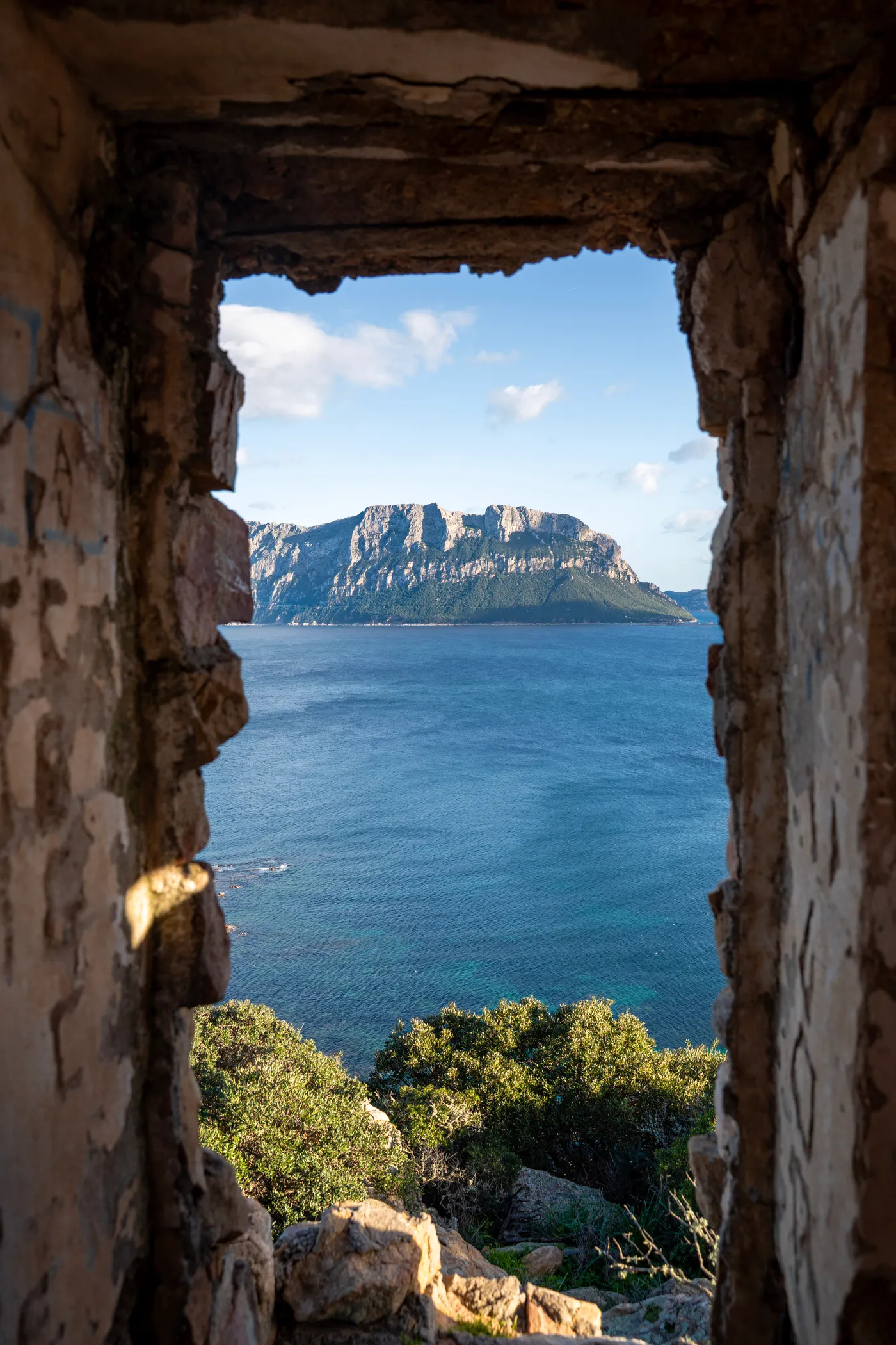 Tavolara through the window of a ruin.