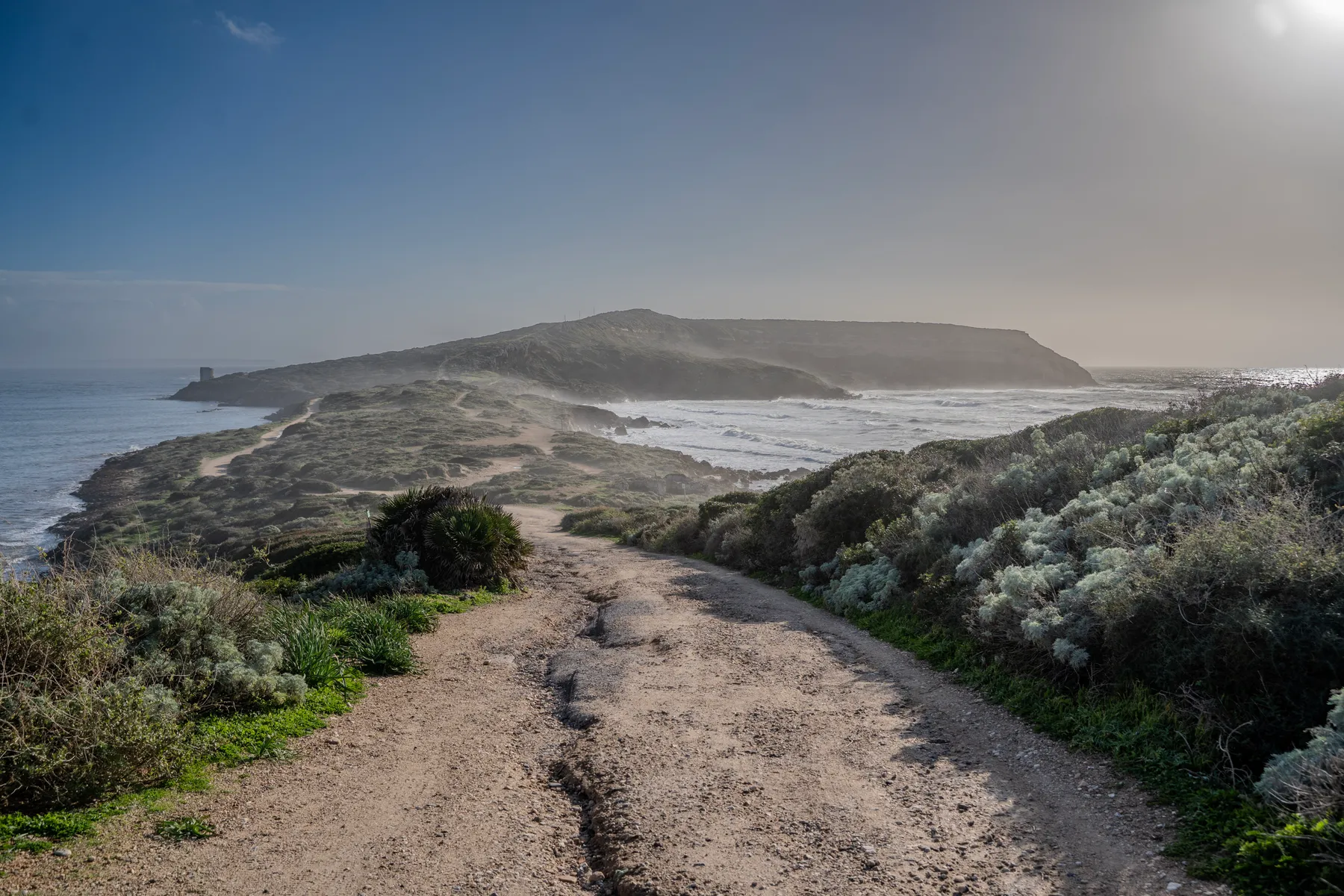 Sea spray hanging over the path to the cape.