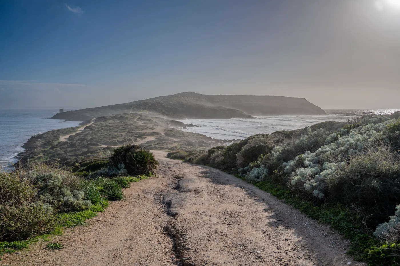 Sea spray hanging over the path to the cape.