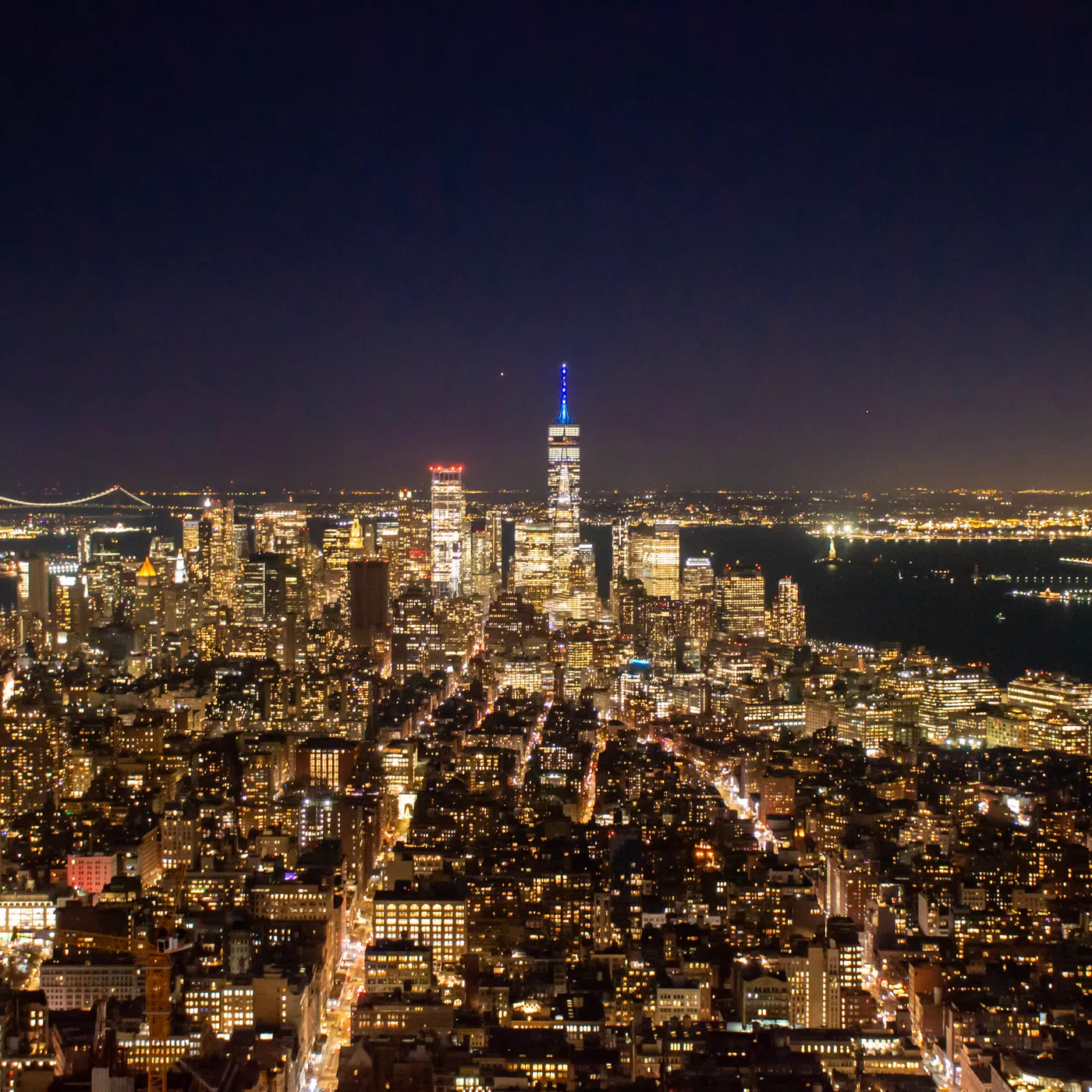 Downtown from above at night, the bridges to Brooklyn on the left.