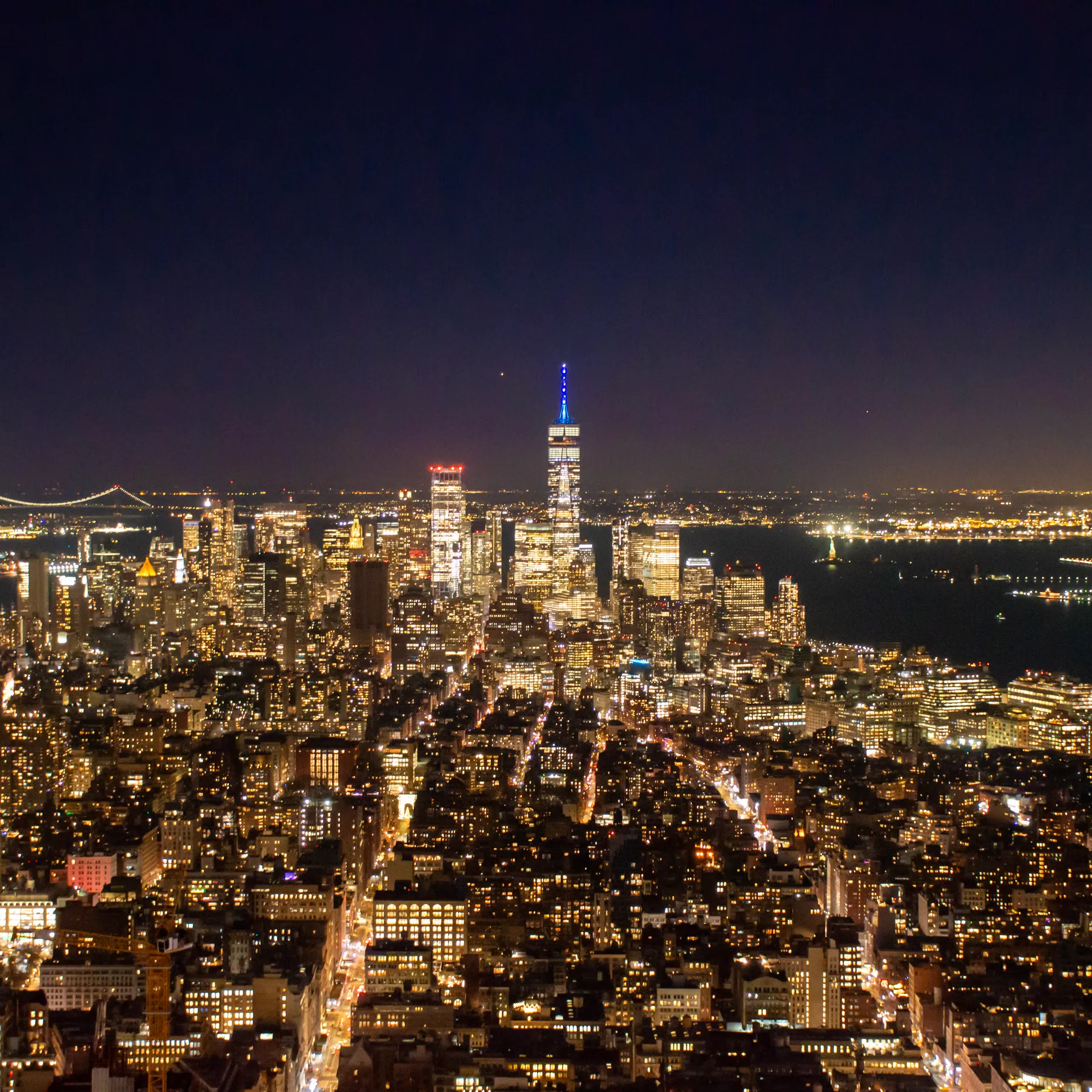 Downtown from above at night, the bridges to Brooklyn on the left.